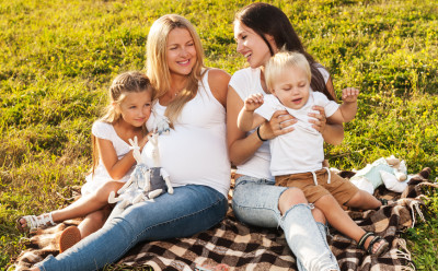 Moms, family having a picnic