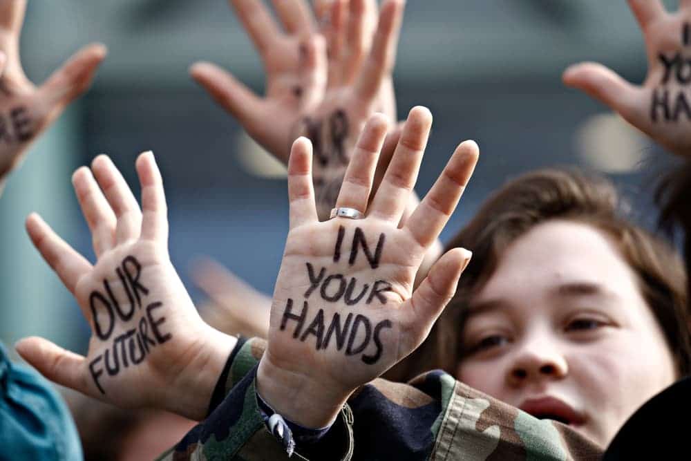People's hands in the air promoting democracy